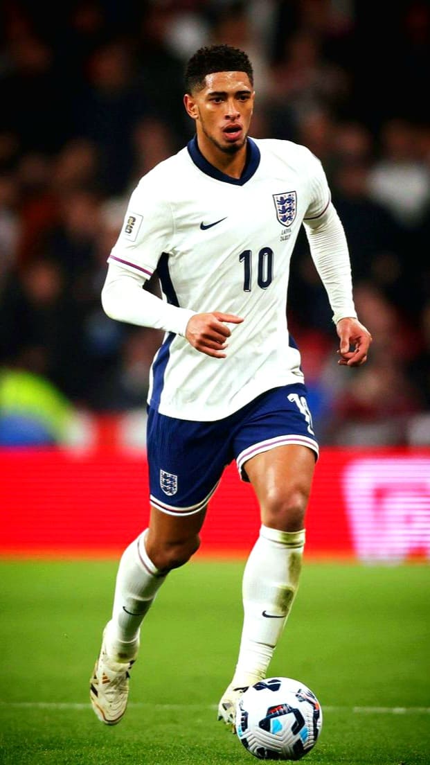 A soccer player in an England kit, number 10, runs on the field while controlling the ball during a match, as fans around the world tune in via IPTV Italy to catch the action live.